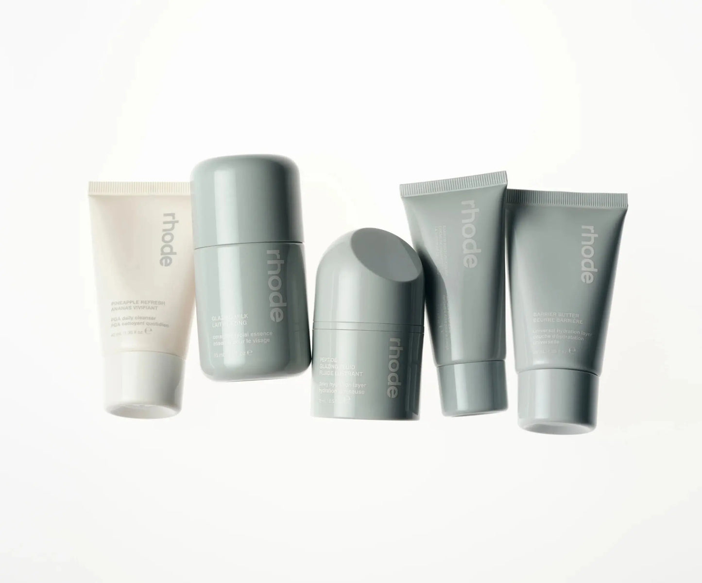 THE TRAVEL SET five-piece mini skincare set by Rhode - portable travel-size skincare essentials for hydrated glowing skin on-the-go