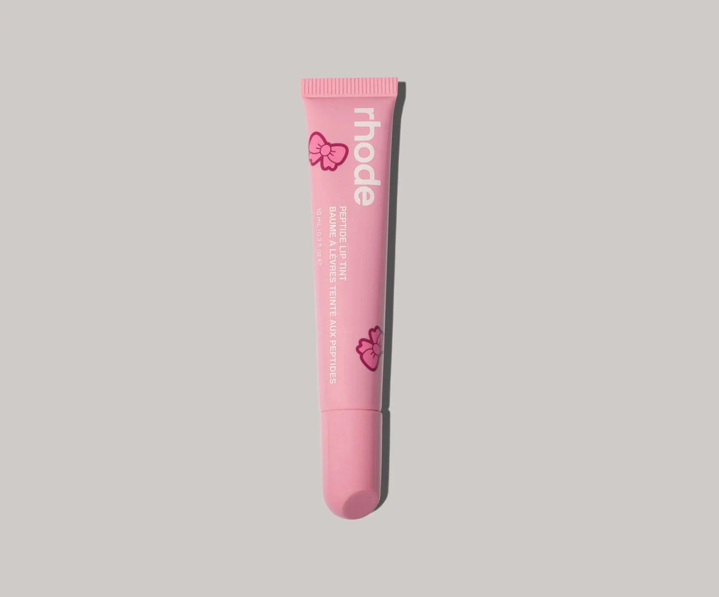 Peptide Lip Tint Ribbon Limited Edition tinted lip gloss by Rhode - sheer color with glossy finish and lip care benefits